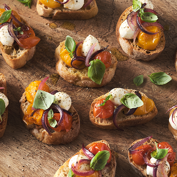 Roasted Cherry Tomato Bocconcini and Basil Crostini Birra Moretti